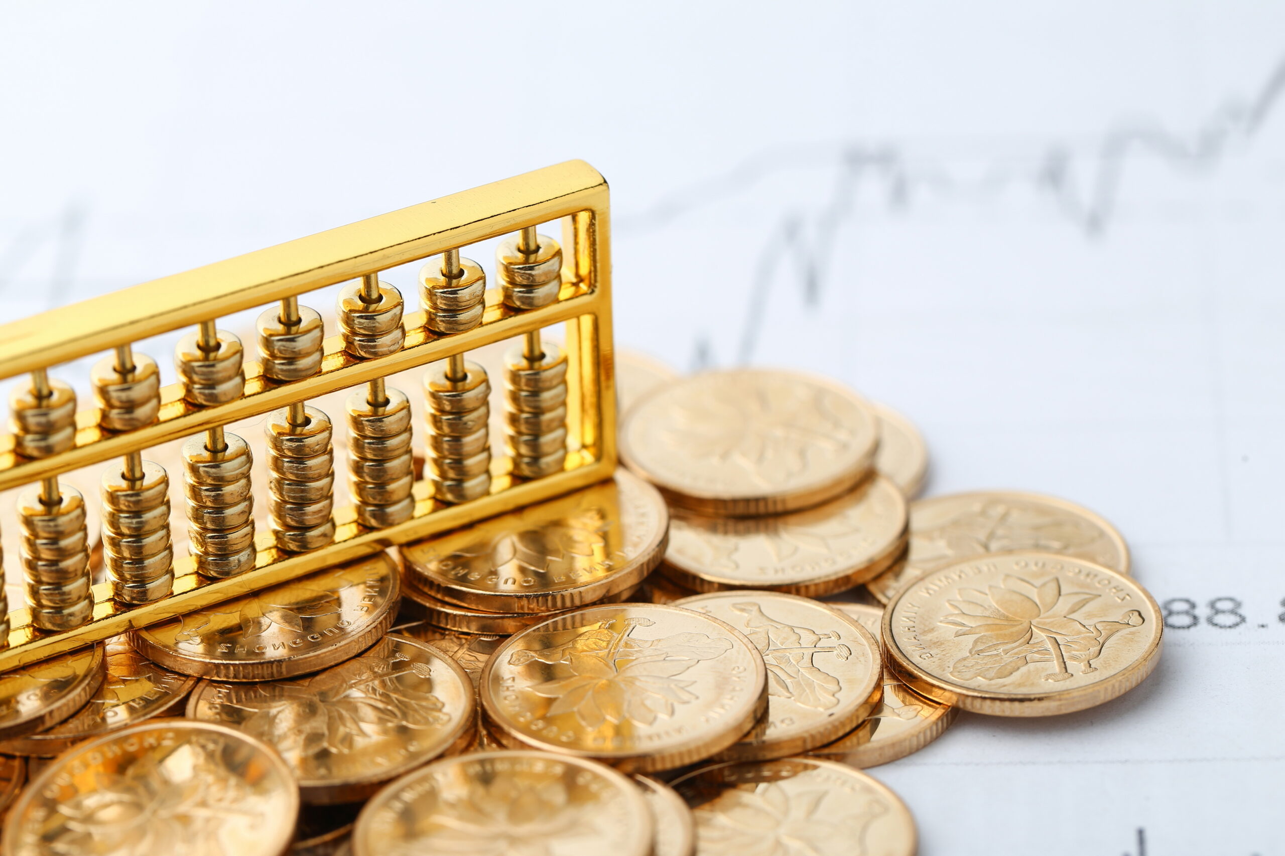 golden-abacus-with-chinese-rmb-gold-coins-as-background-1